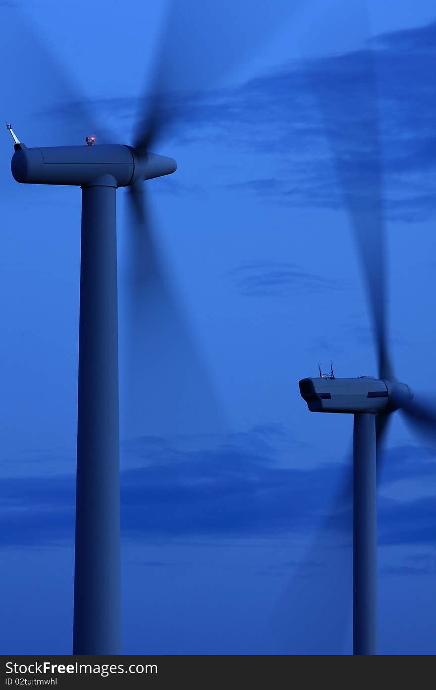 Two wind turbines in the evening light