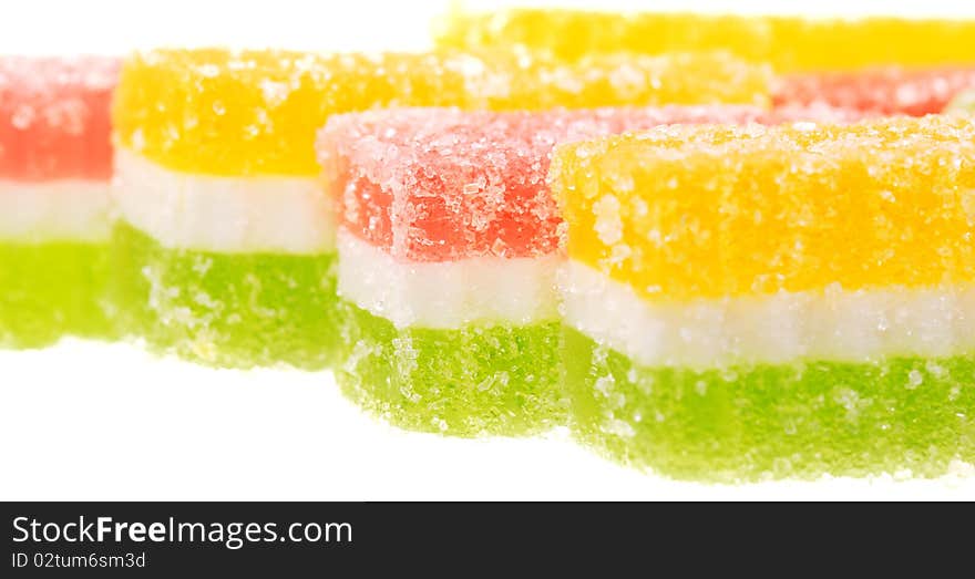 Fruit candy slices on the isolated white. Fruit candy slices on the isolated white