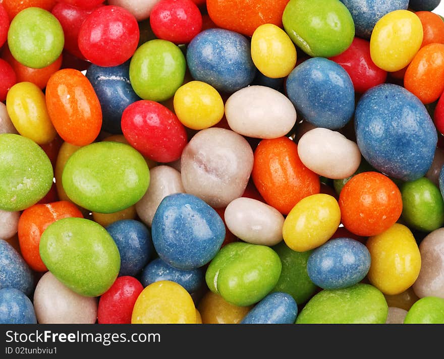 Background from multicolored sweets covered with glaze