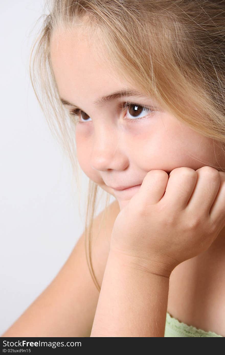 Beautiful young girl against a light background. Beautiful young girl against a light background