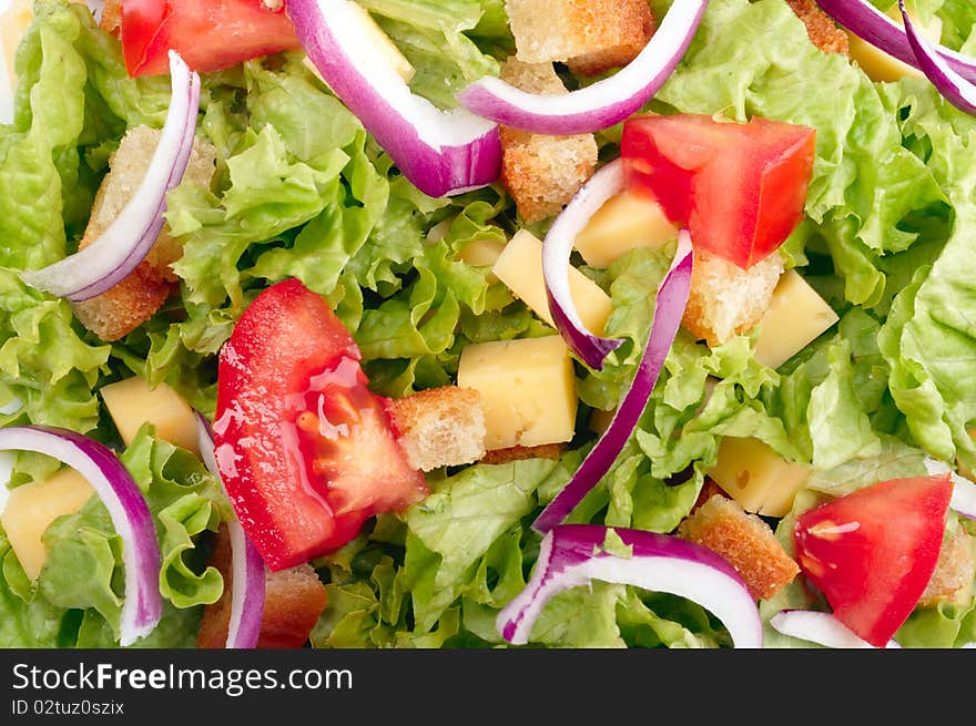 Salad with tomato, cheese and croutons background. Salad with tomato, cheese and croutons background