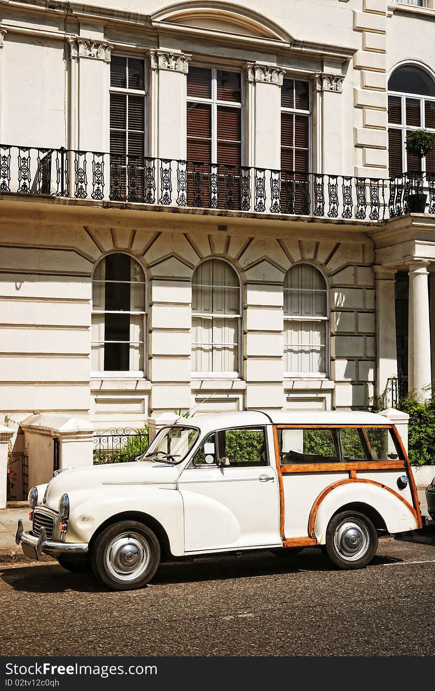 Elegant apartment building and an old car at  Notting Hill, London. Elegant apartment building and an old car at  Notting Hill, London.