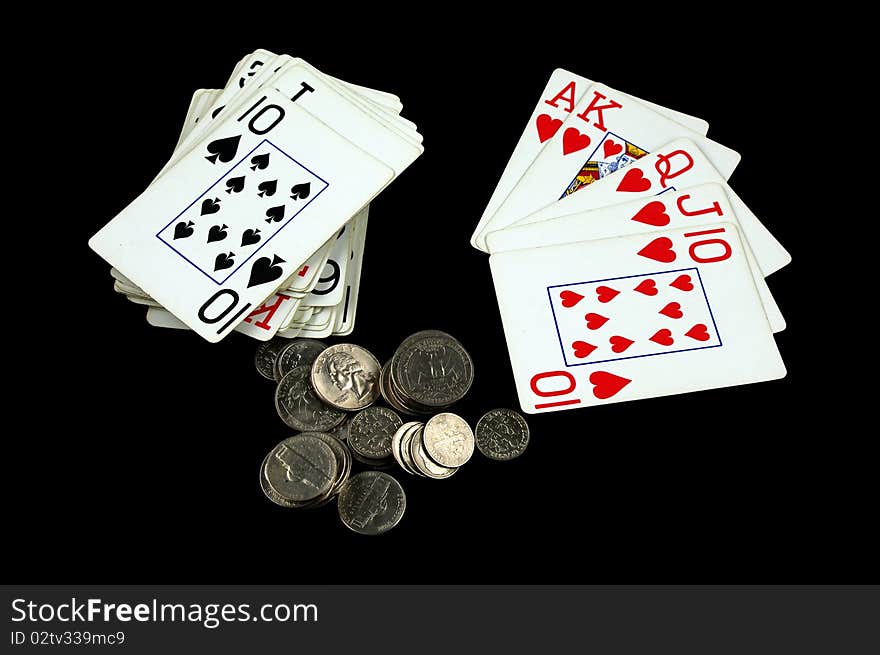 Royal Flush Card Hand with Change Isolated on black. Royal Flush Card Hand with Change Isolated on black