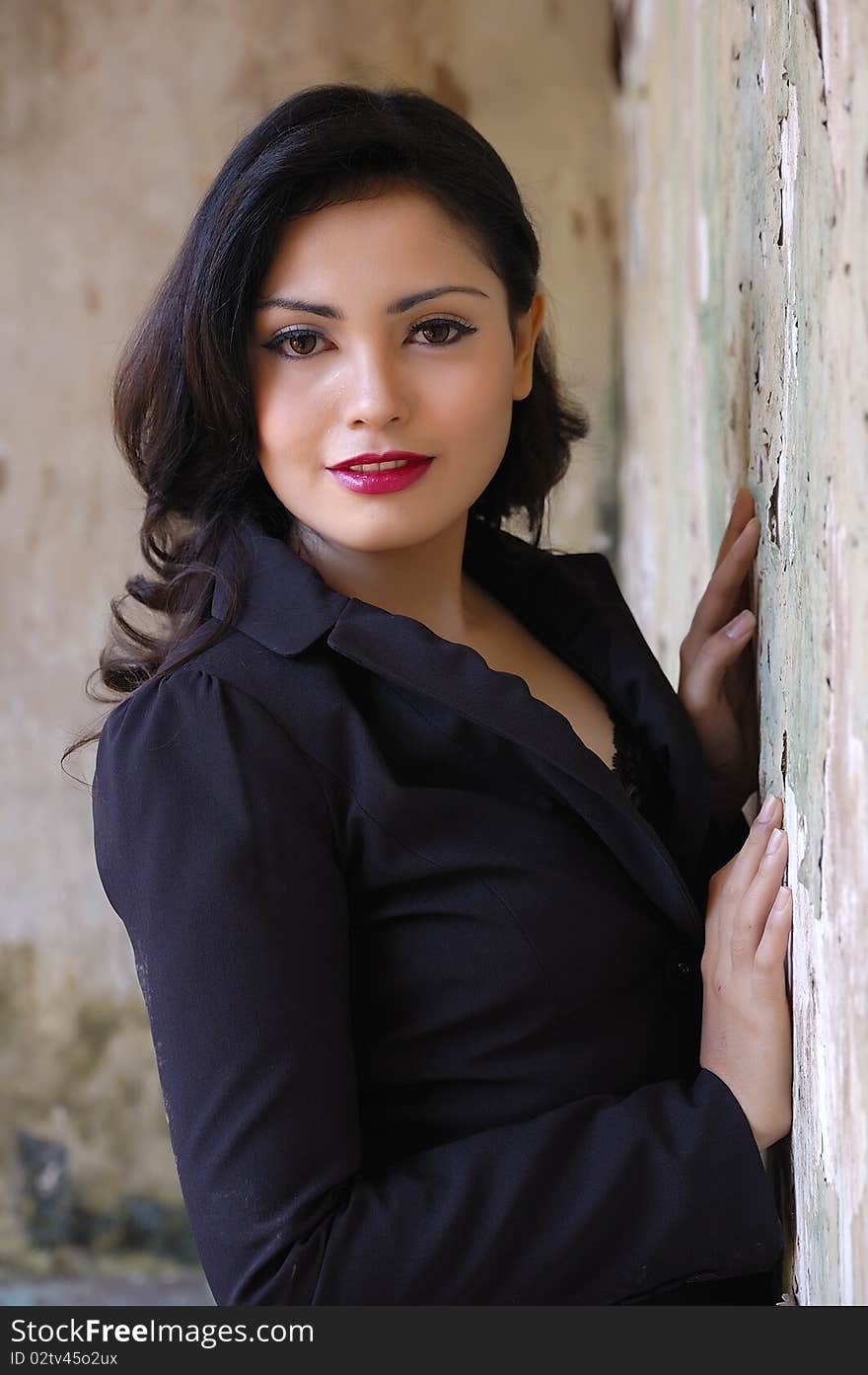 Pretty business woman wearing black suit, posing at outdoor. Pretty business woman wearing black suit, posing at outdoor