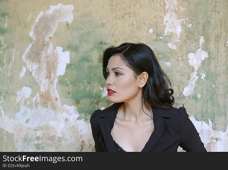 Pretty business woman wearing black suit, posing at outdoor. Pretty business woman wearing black suit, posing at outdoor