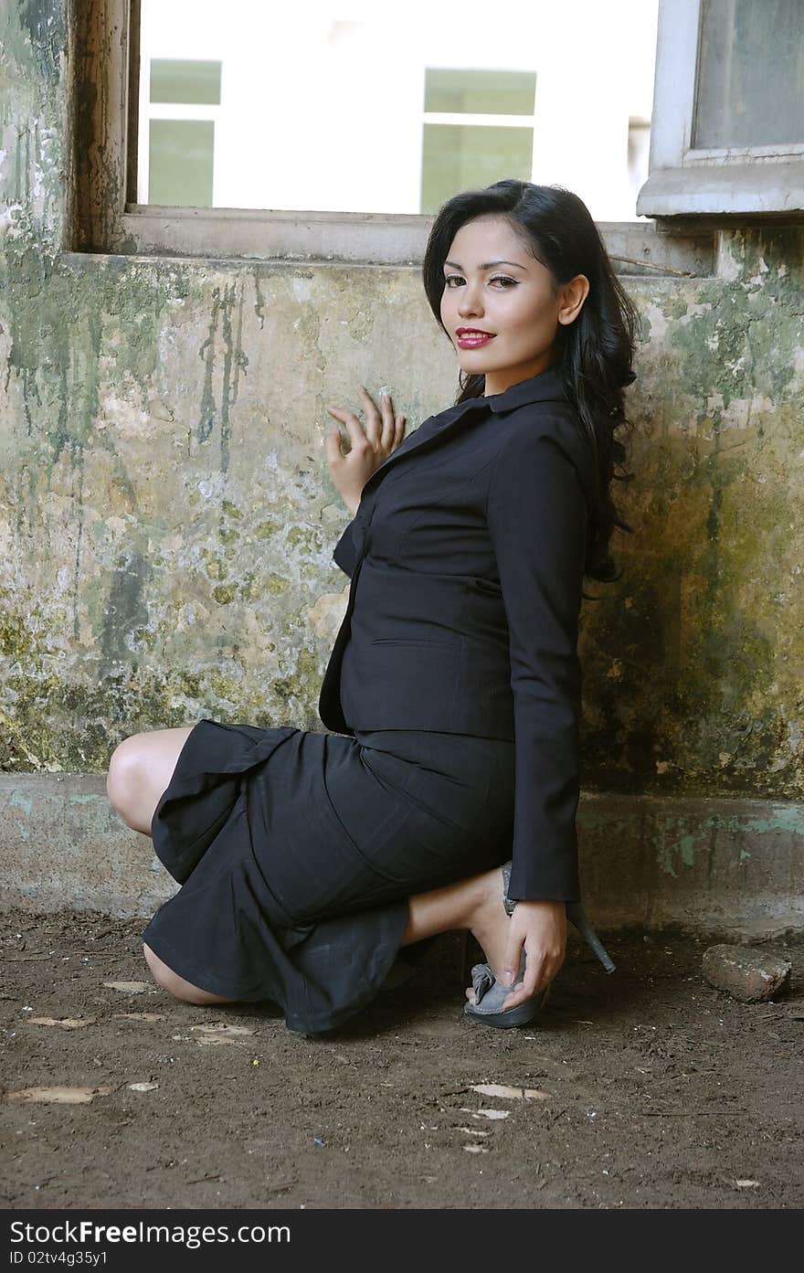 Pretty business woman wearing black suit, posing at outdoor. Pretty business woman wearing black suit, posing at outdoor