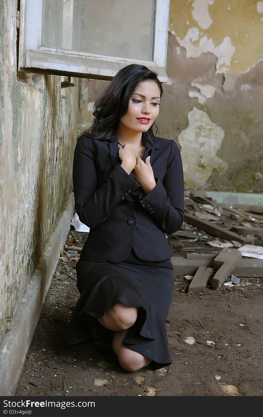 Pretty business woman wearing black suit, posing at outdoor. Pretty business woman wearing black suit, posing at outdoor