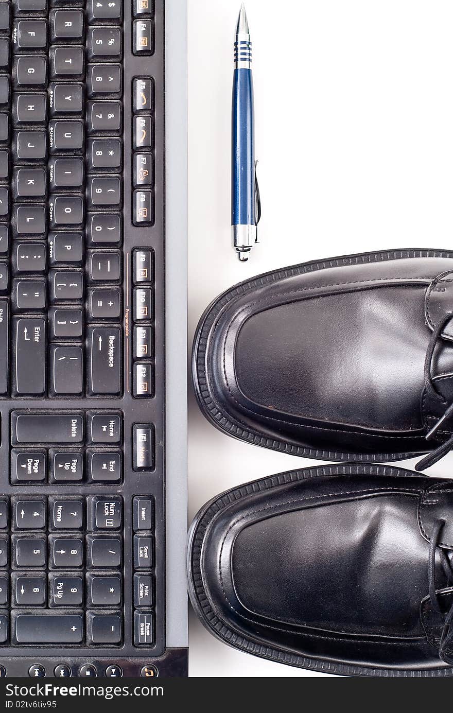 Mens Dress Shoes Toe view with Keyboard and Pen for business fashion and professional concepts. Mens Dress Shoes Toe view with Keyboard and Pen for business fashion and professional concepts