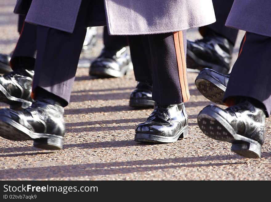 Close up of a British soldier's boot marching in dress uniform on parade at Buckingham Place London UK