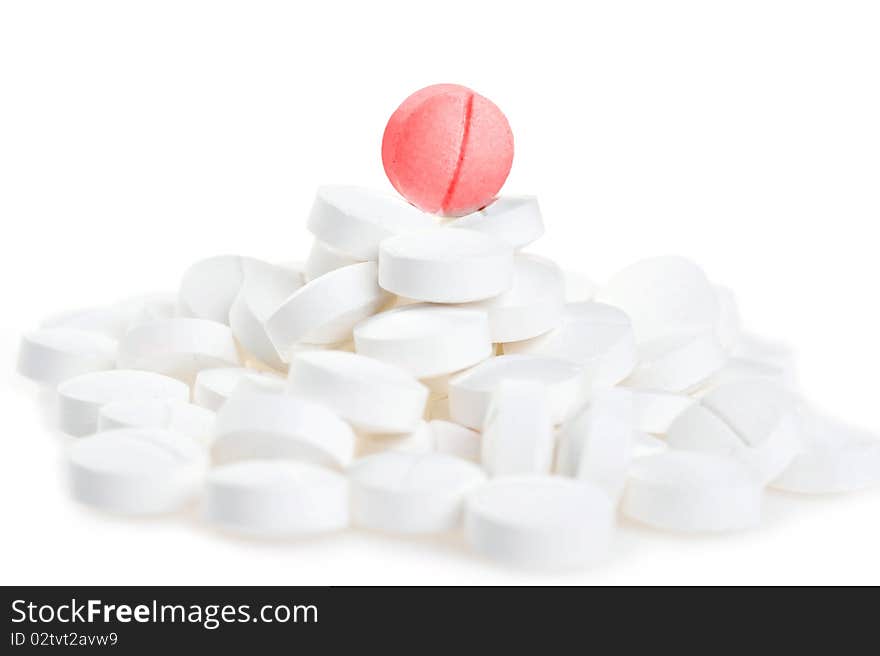 White tablets scattered on table