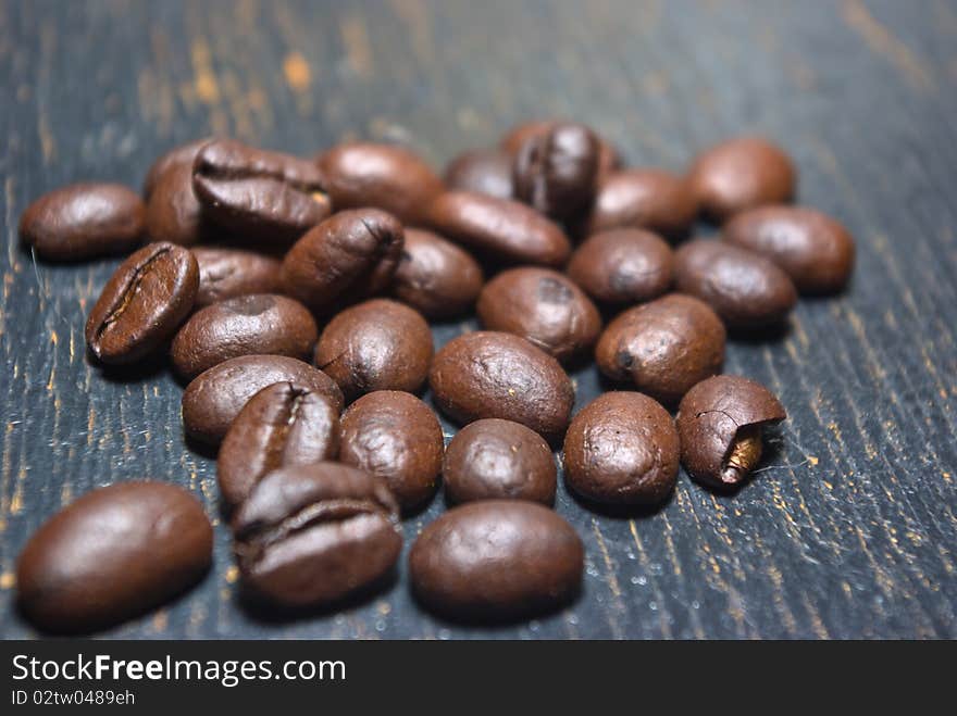 The fragrant fried coffee beans grunge background. The fragrant fried coffee beans grunge background