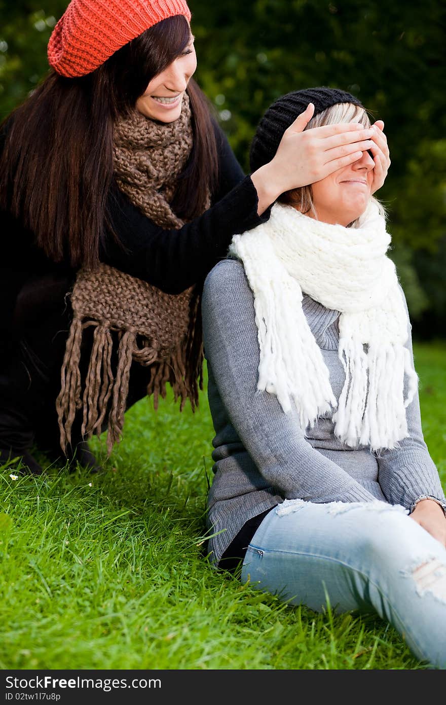 Playful girls closing holding eyes. Playful girls closing holding eyes