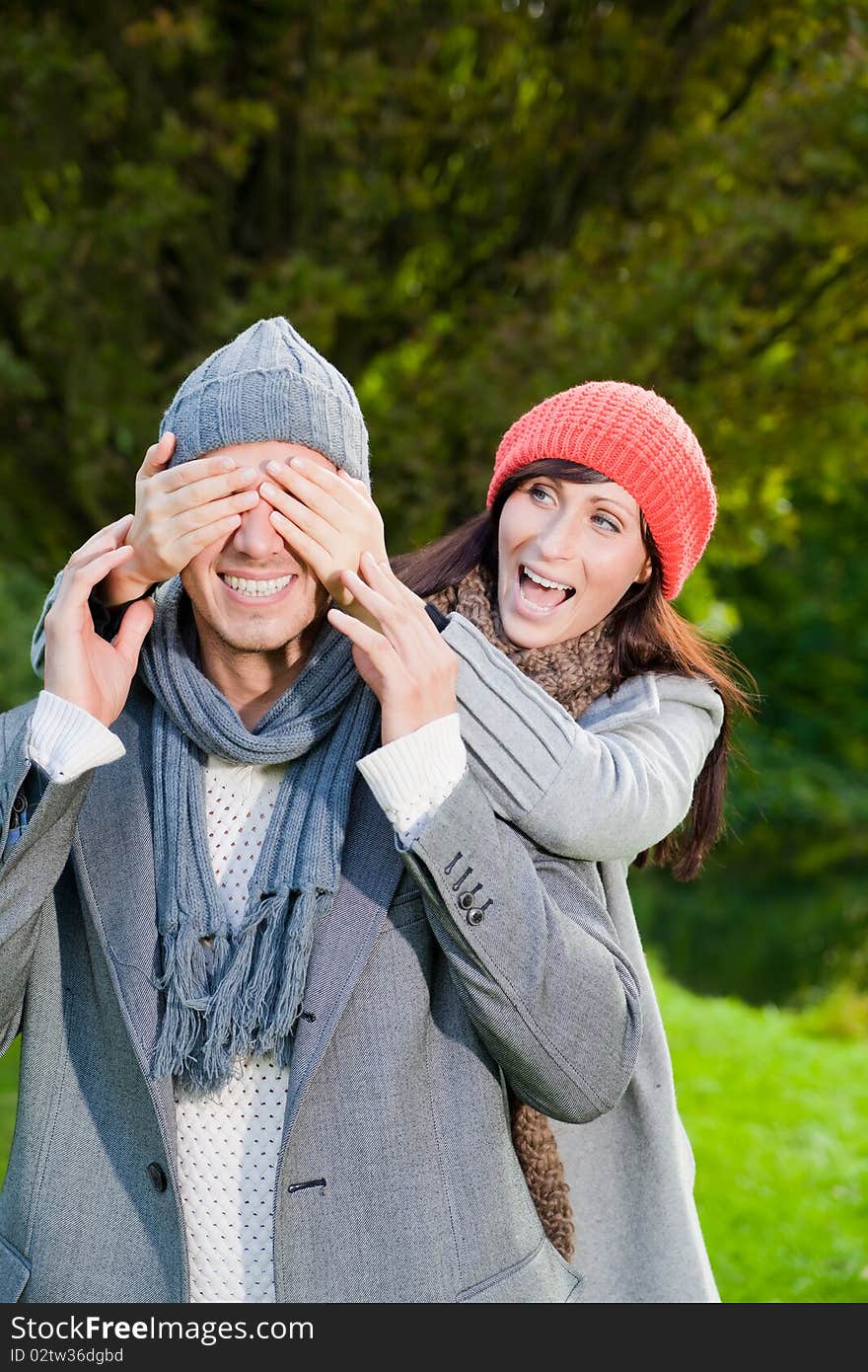 Embracing laughing love couple in autumn season