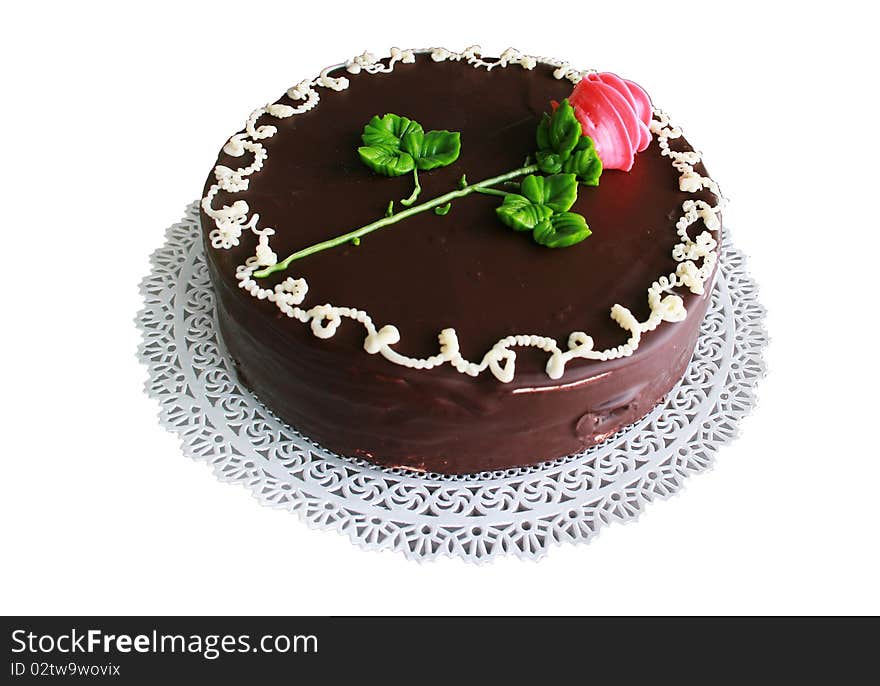 Chocolate pie with a red rose on a napkin