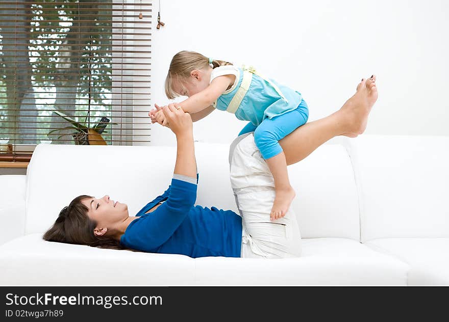 Mother and daughter having fun at home. Mother and daughter having fun at home