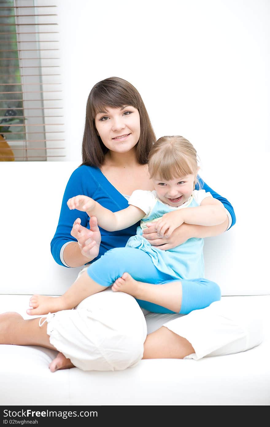 Mother and daughter having fun at home. Mother and daughter having fun at home