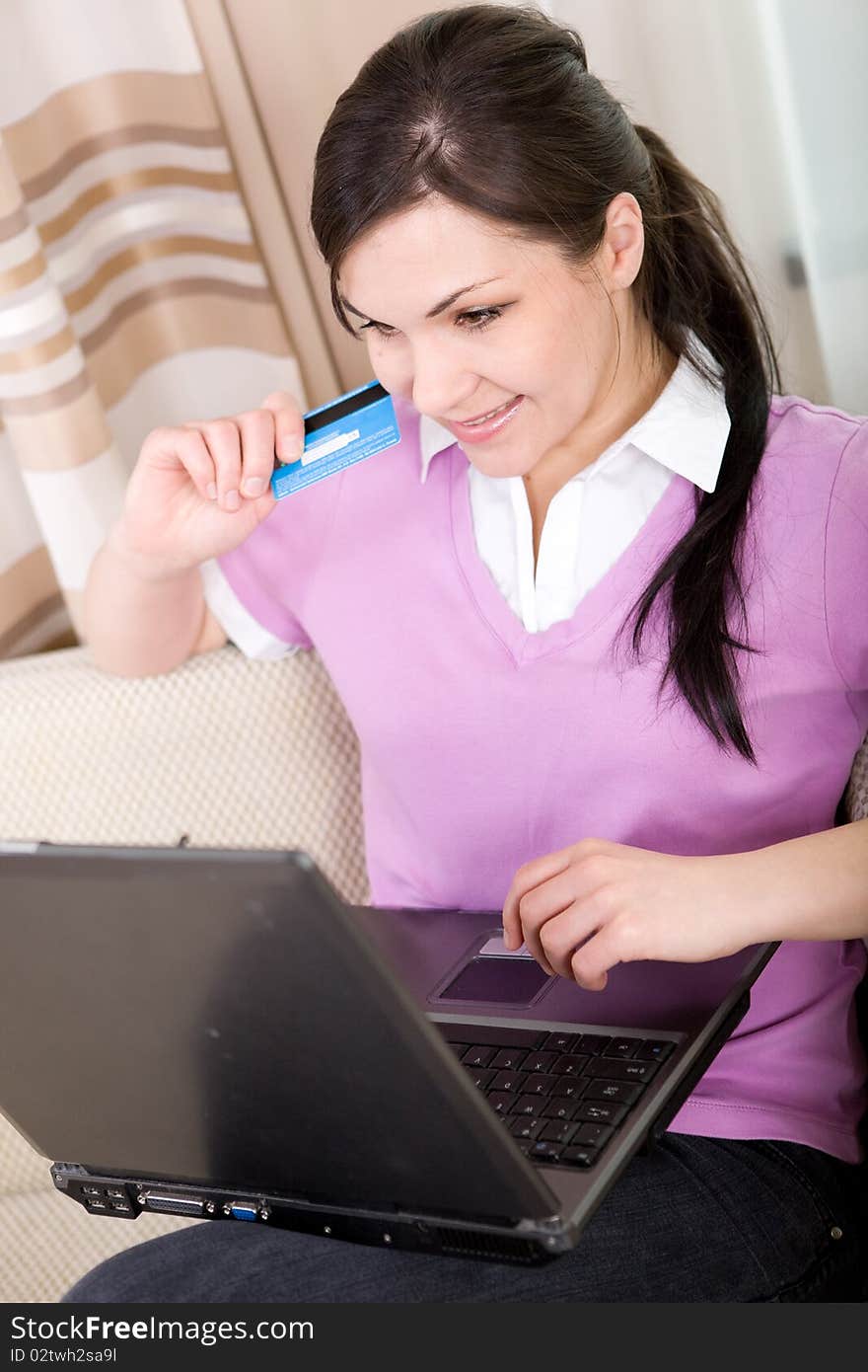 Young adult woman buying something online. Young adult woman buying something online