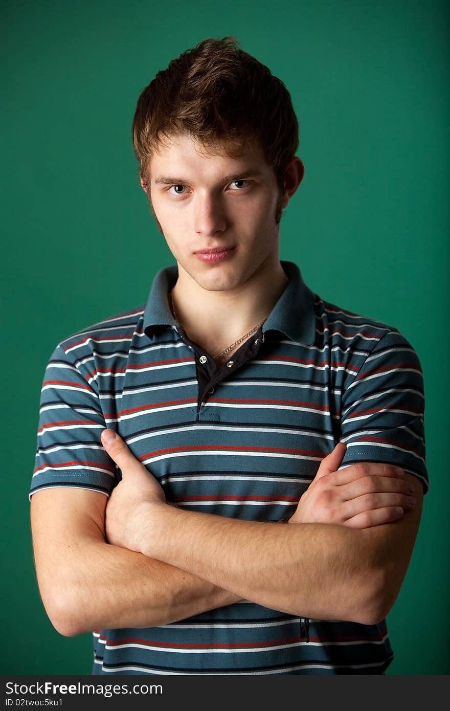 Young guy on a green background