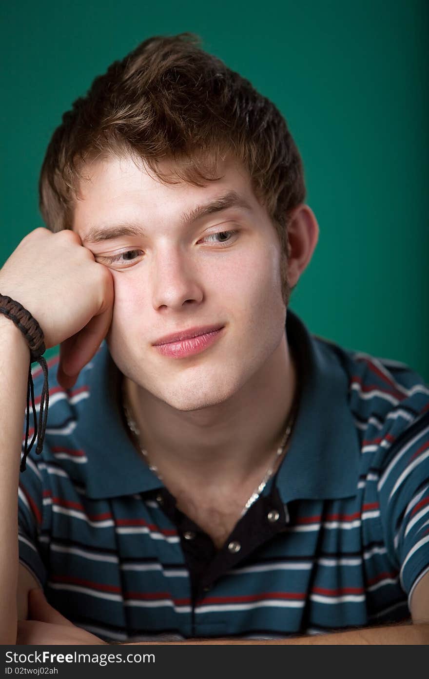 Young guy on a green background