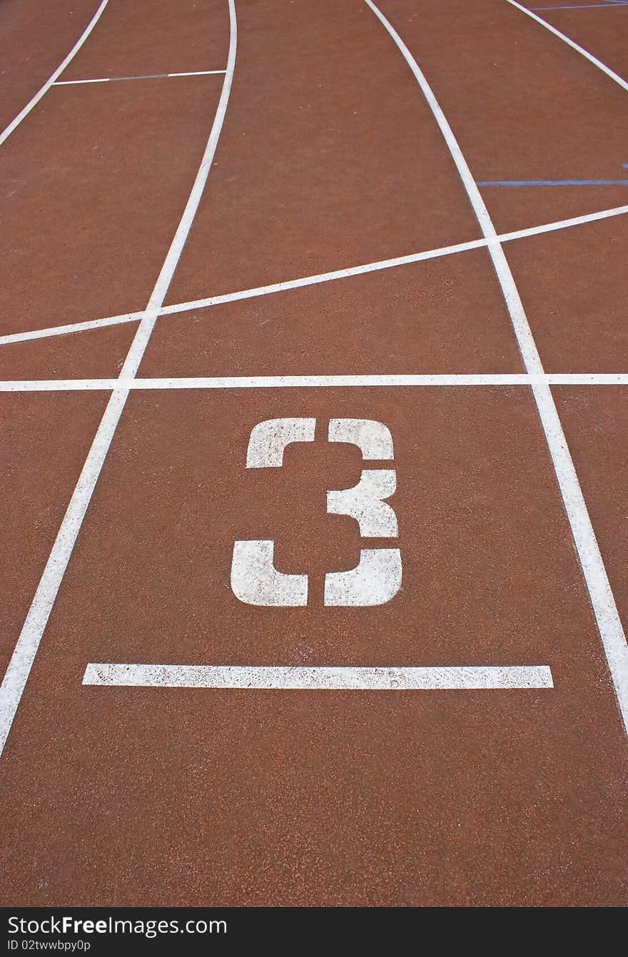 Marking the treadmill with white stripes and a number 3. Marking the treadmill with white stripes and a number 3