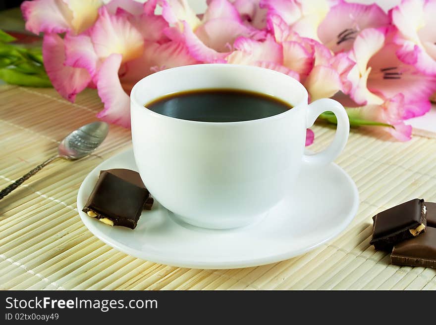 Coffee in white cup with chocolate