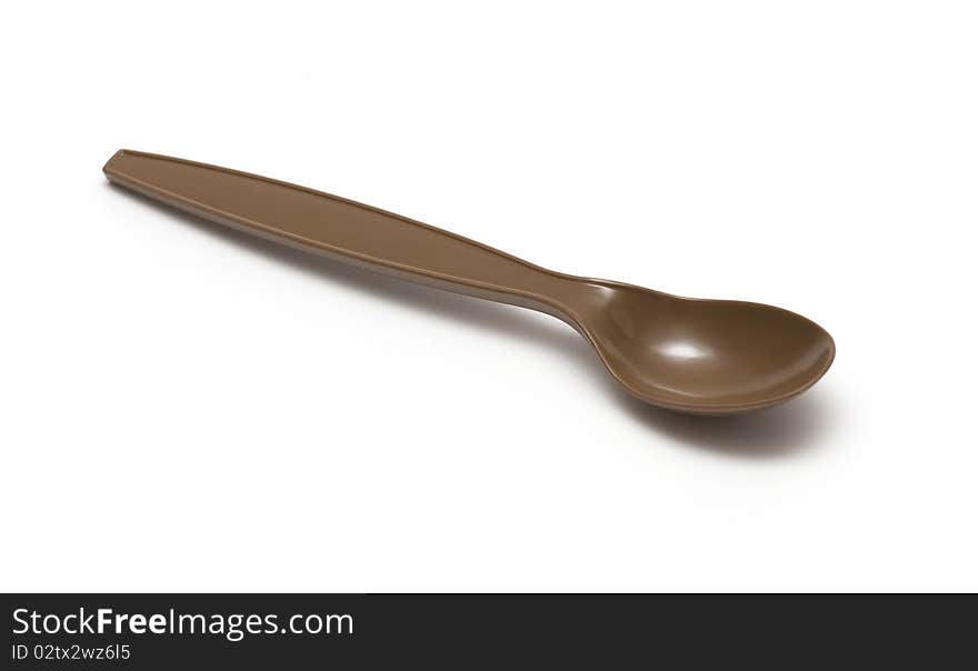 Plastic spoon on a white background