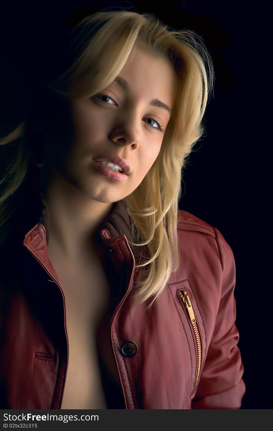 Young beautiful girl in red leather jacket