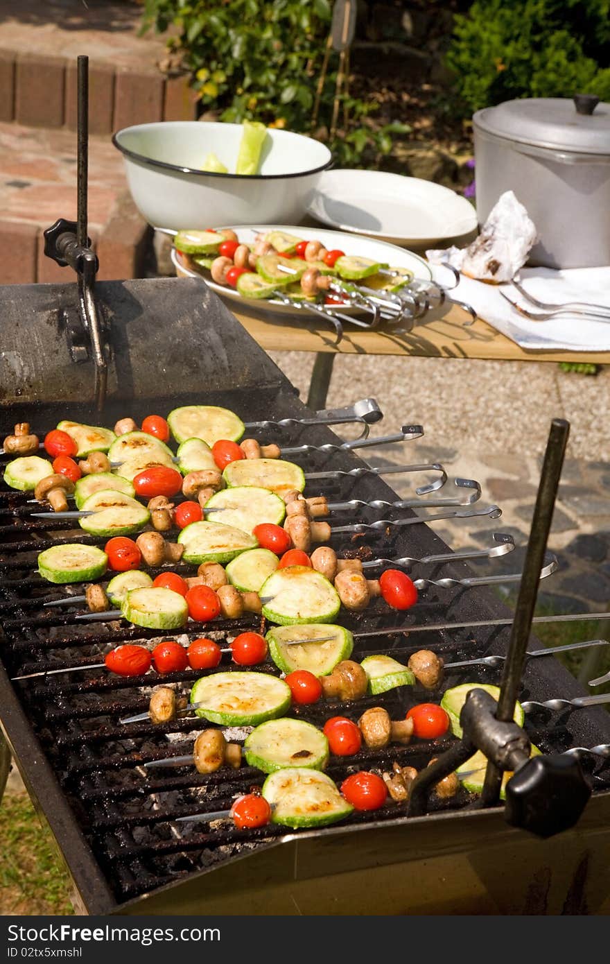 Vegetable kebab with mushrooms, zucchini and cherry tomatoes. Vegetable kebab with mushrooms, zucchini and cherry tomatoes.