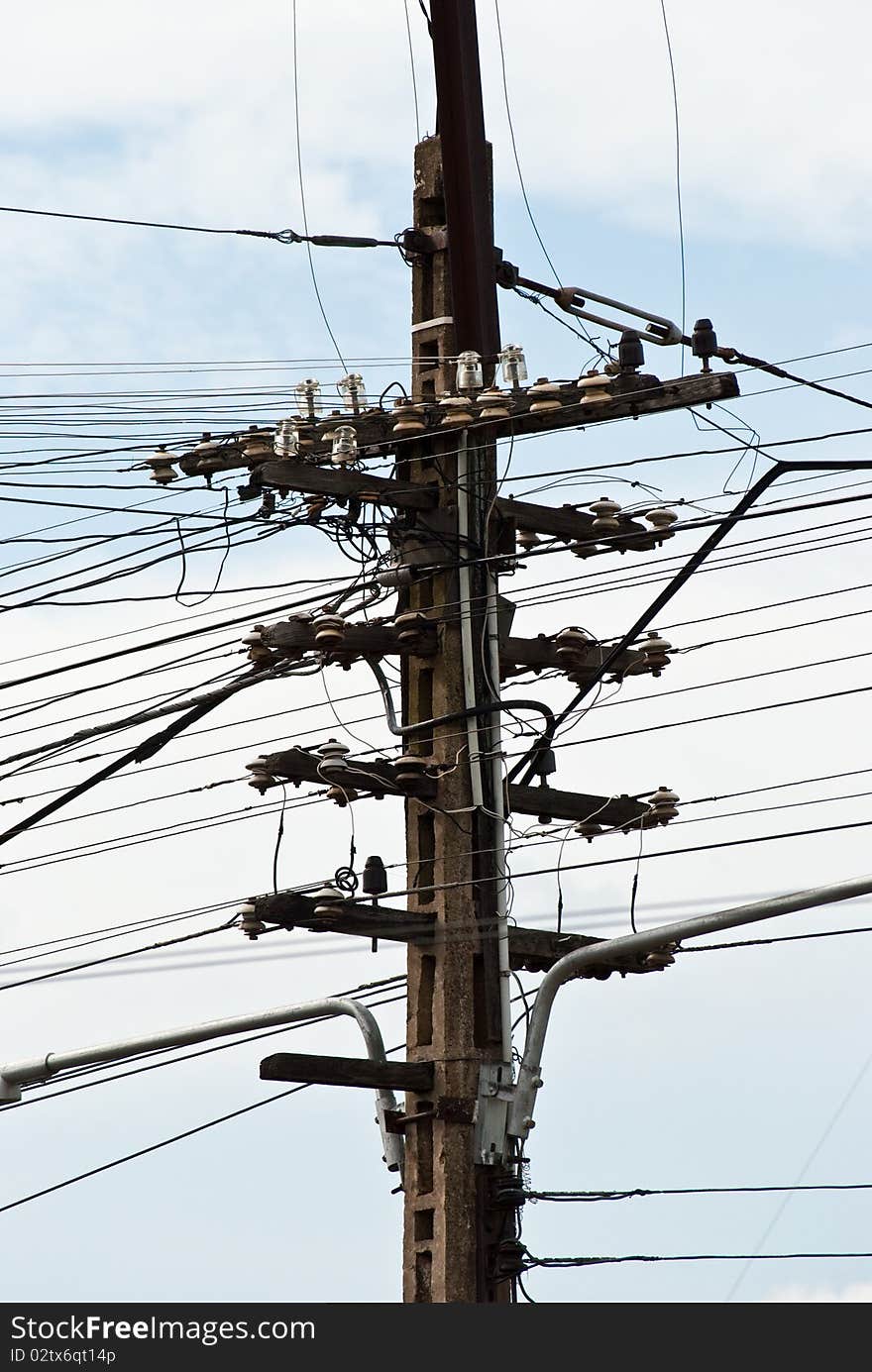 Towers support power lines with sky background of