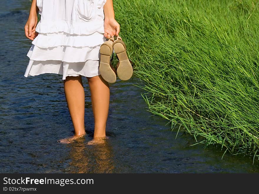 Girl S Legs In The Cool Water