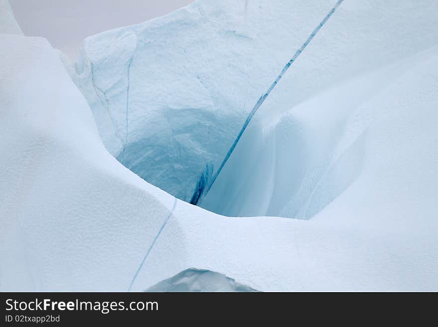 Iceberg in the famous icefjord beside the city of Ilulissat in Greenland. The icefjord is on UNESCO's World Heritage List. Iceberg in the famous icefjord beside the city of Ilulissat in Greenland. The icefjord is on UNESCO's World Heritage List.