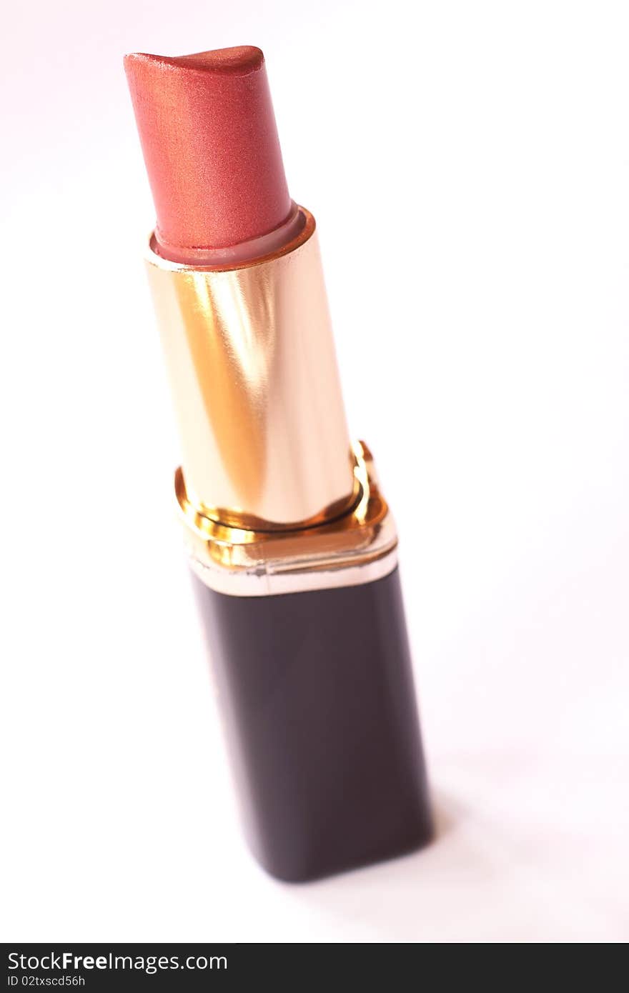 Orange lipstick on white background