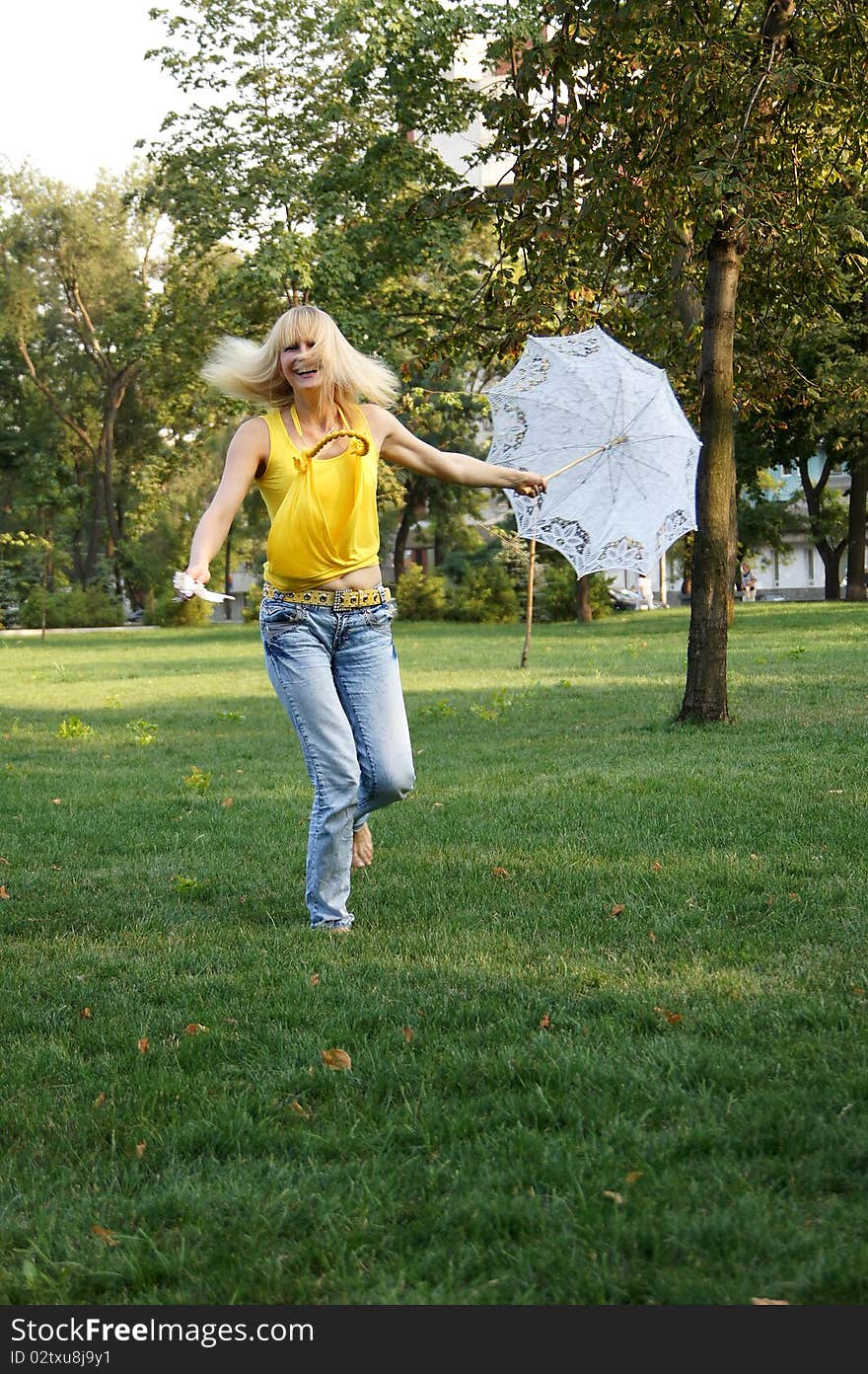 A girl with an umbrella and a fan