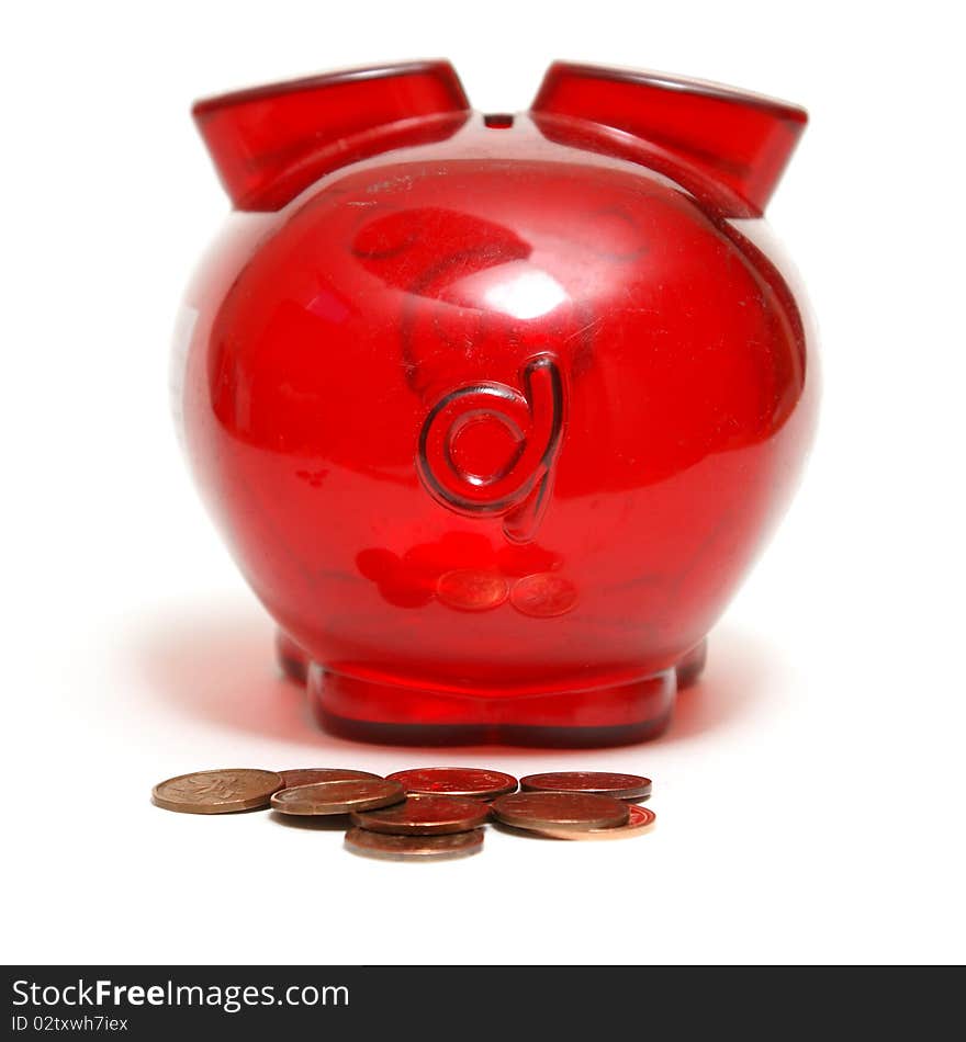 A piggy bank as made some droppings in the form of pennies. A piggy bank as made some droppings in the form of pennies.