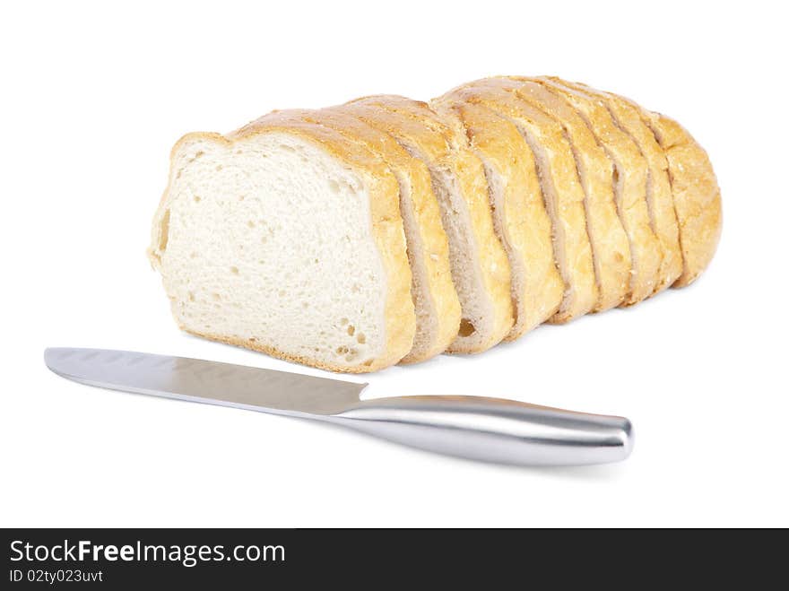 Bread and knife on white background(isolated). Bread and knife on white background(isolated).