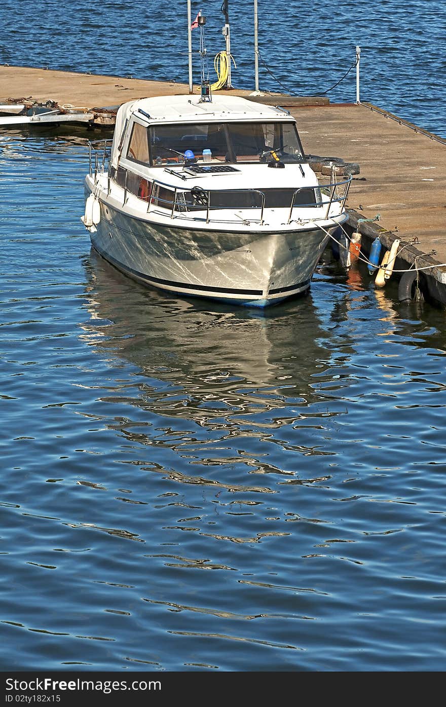 A power boat at a dockside