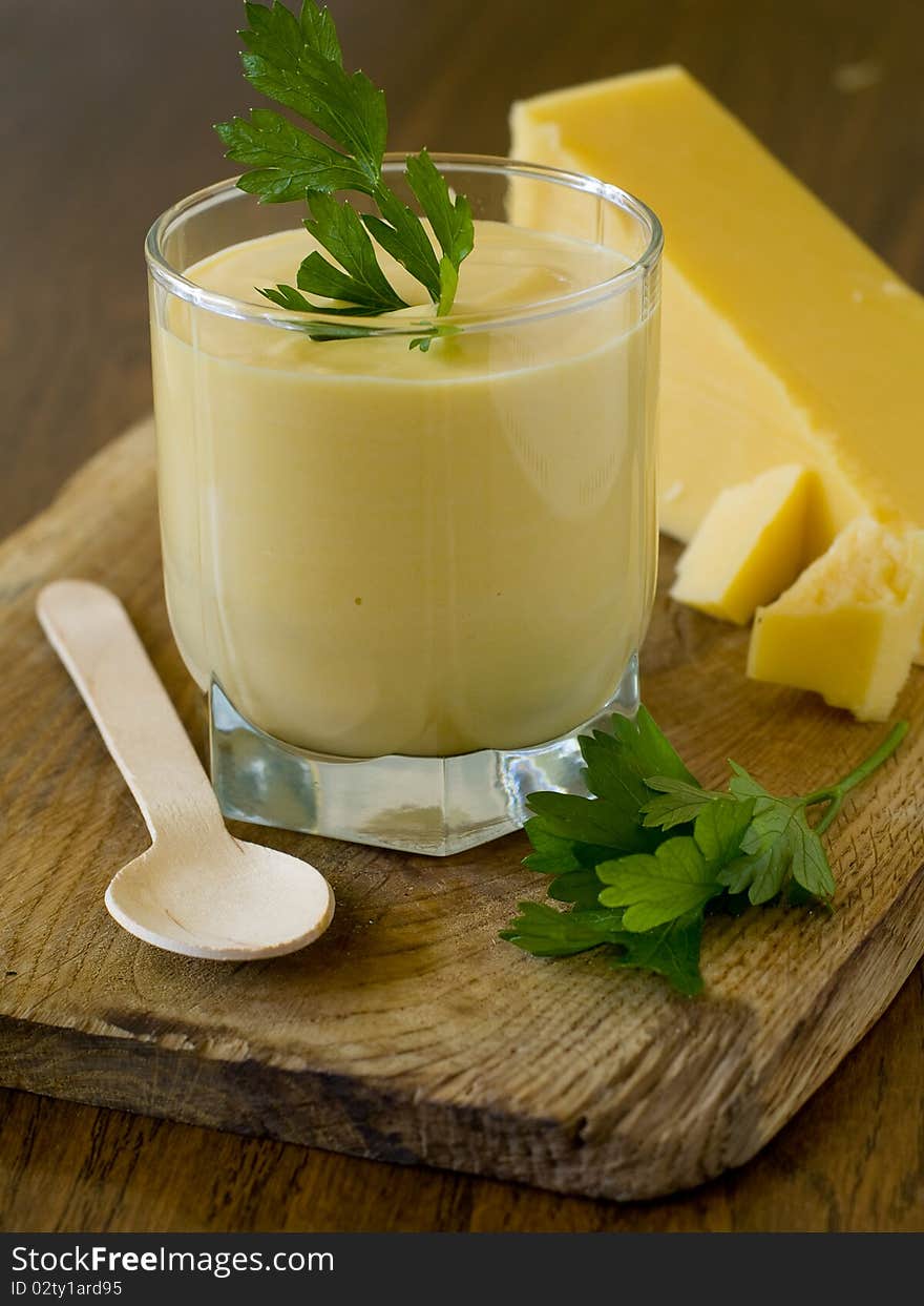 Cheese soup with roasted garlic and cheese chips