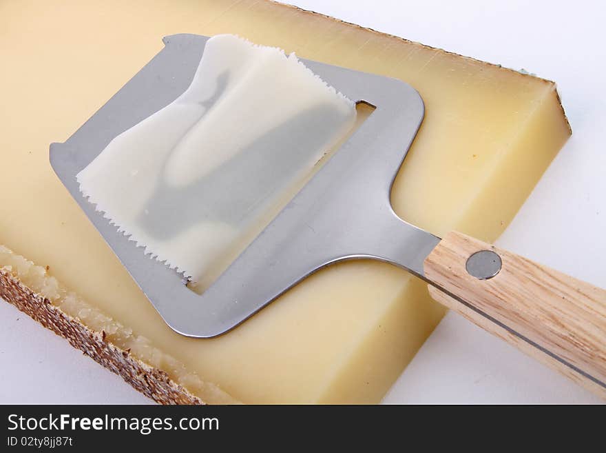 Slice of cheese on white background