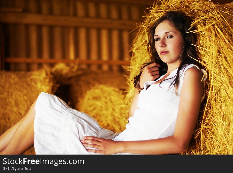 A Young Woman Is Resting On The Hay