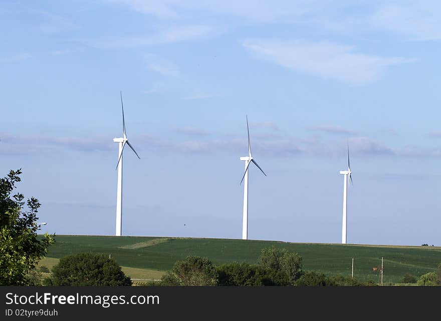 Windmill farm in the breezy hills of Iowa. Windmill farm in the breezy hills of Iowa