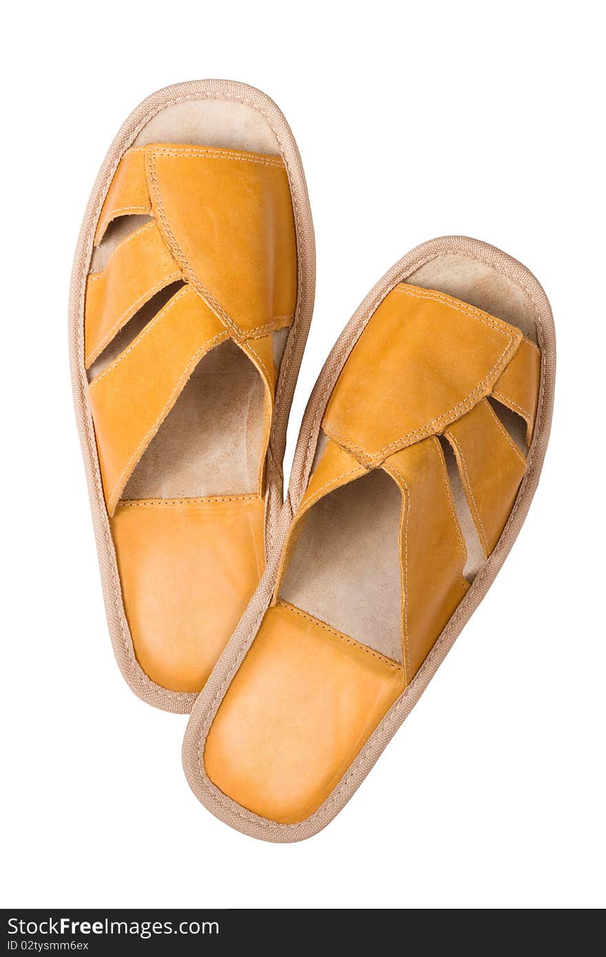 Isolated yellow leather comfortable slippers, home shoes