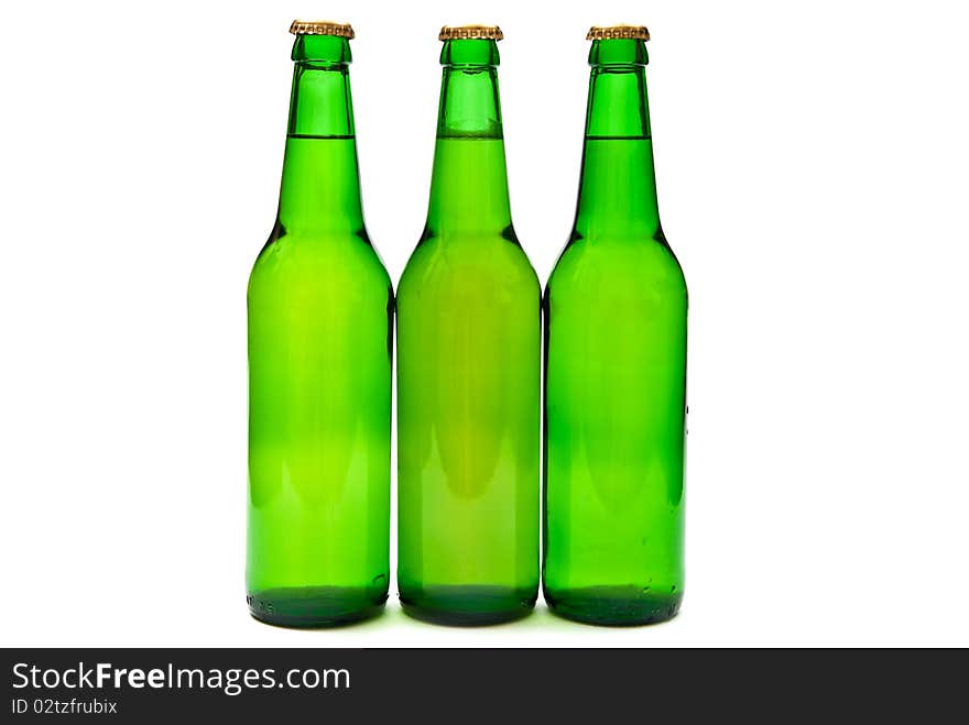 Three beer bottles on white background. Three beer bottles on white background.