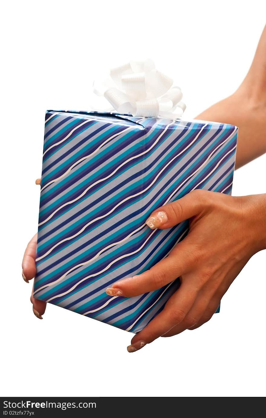 Blue christmas present on the woman's hands. White background. Blue christmas present on the woman's hands. White background