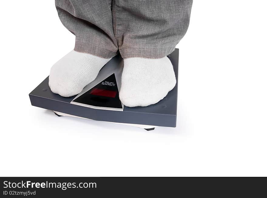 Man standing on bathroom scale. Man standing on bathroom scale