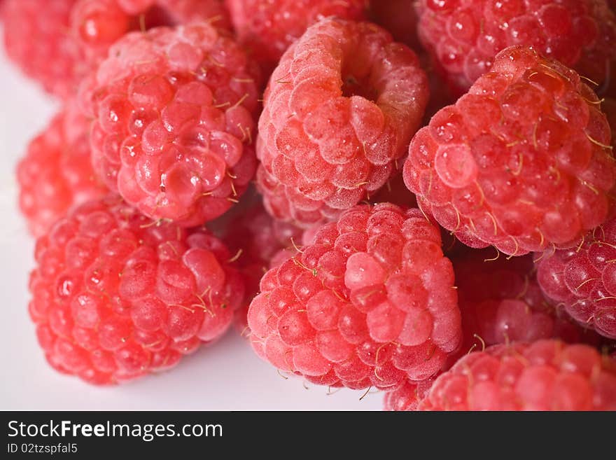 Raspberries on a white plate