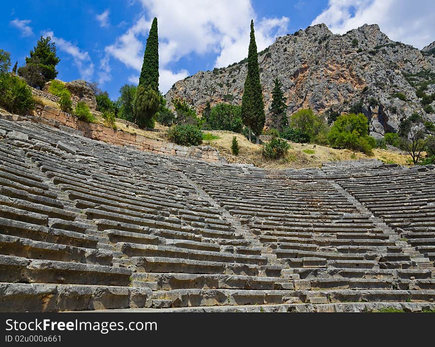 Ruins of amphitheater in Delphi, Greece - archaeology background