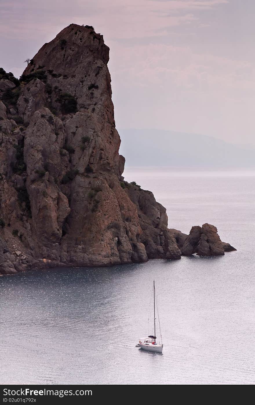 Alone sailboat in tranquil sea