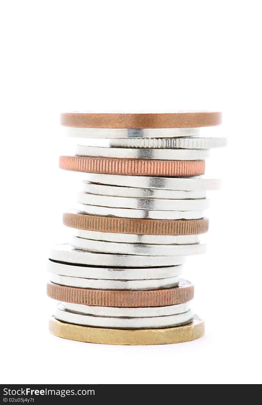 A stack of silver and bronze coins isolated on white. A stack of silver and bronze coins isolated on white