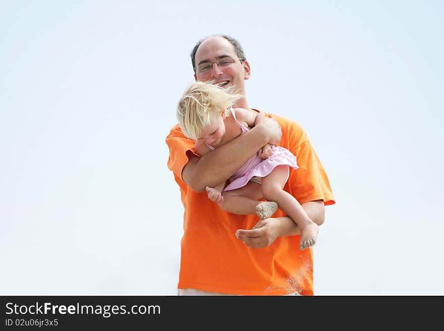 Playing father and daughter on sky background