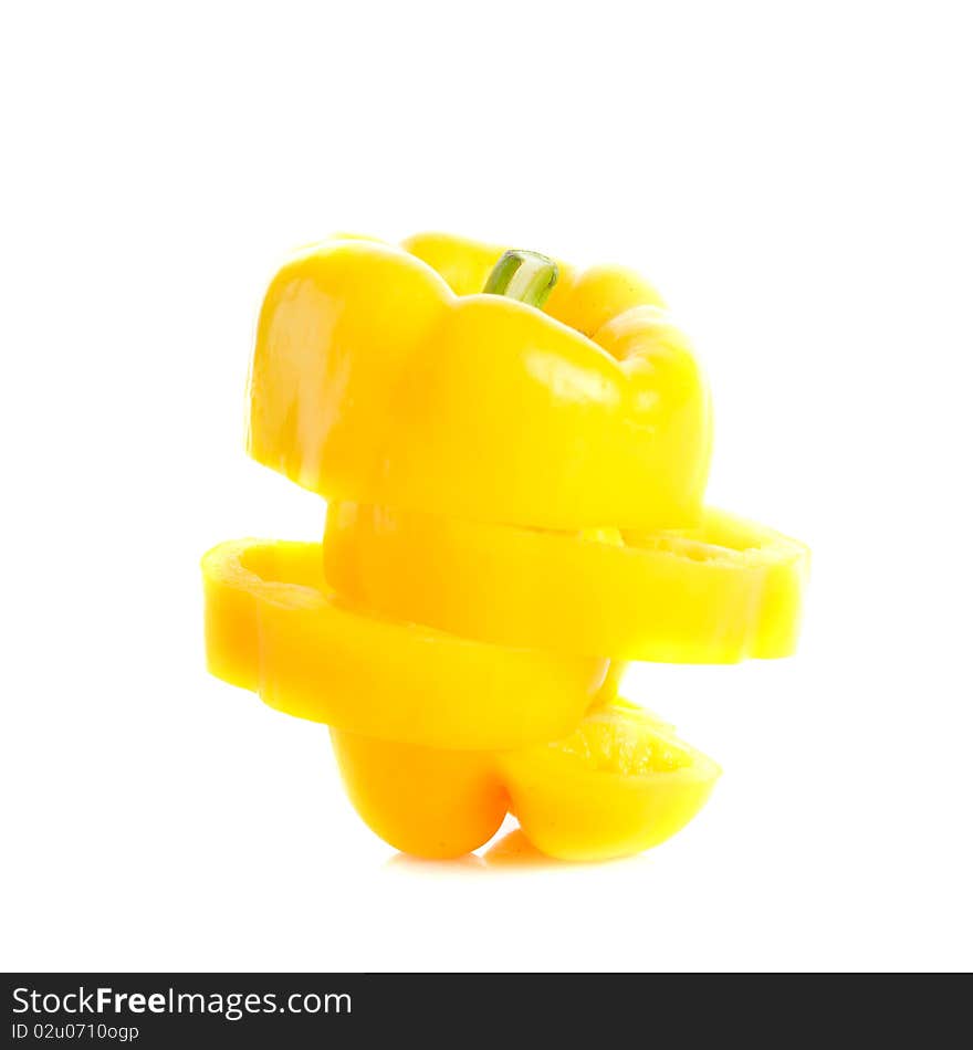 Yellow bell pepper cut and rearranged again isolated on white with copy space. Yellow bell pepper cut and rearranged again isolated on white with copy space